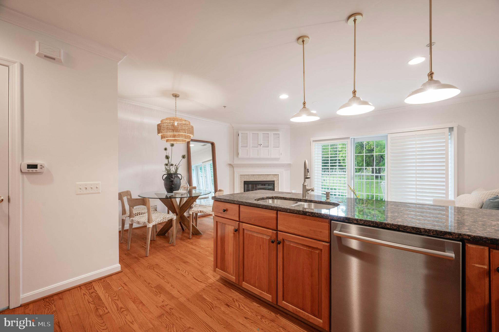 1422 Roundhouse Lane, Unit 1422 Alexandria, VA 22314 - Photo 15 of 73 a kitchen with stainless steel appliances granite countertop a sink a stove and wooden floor