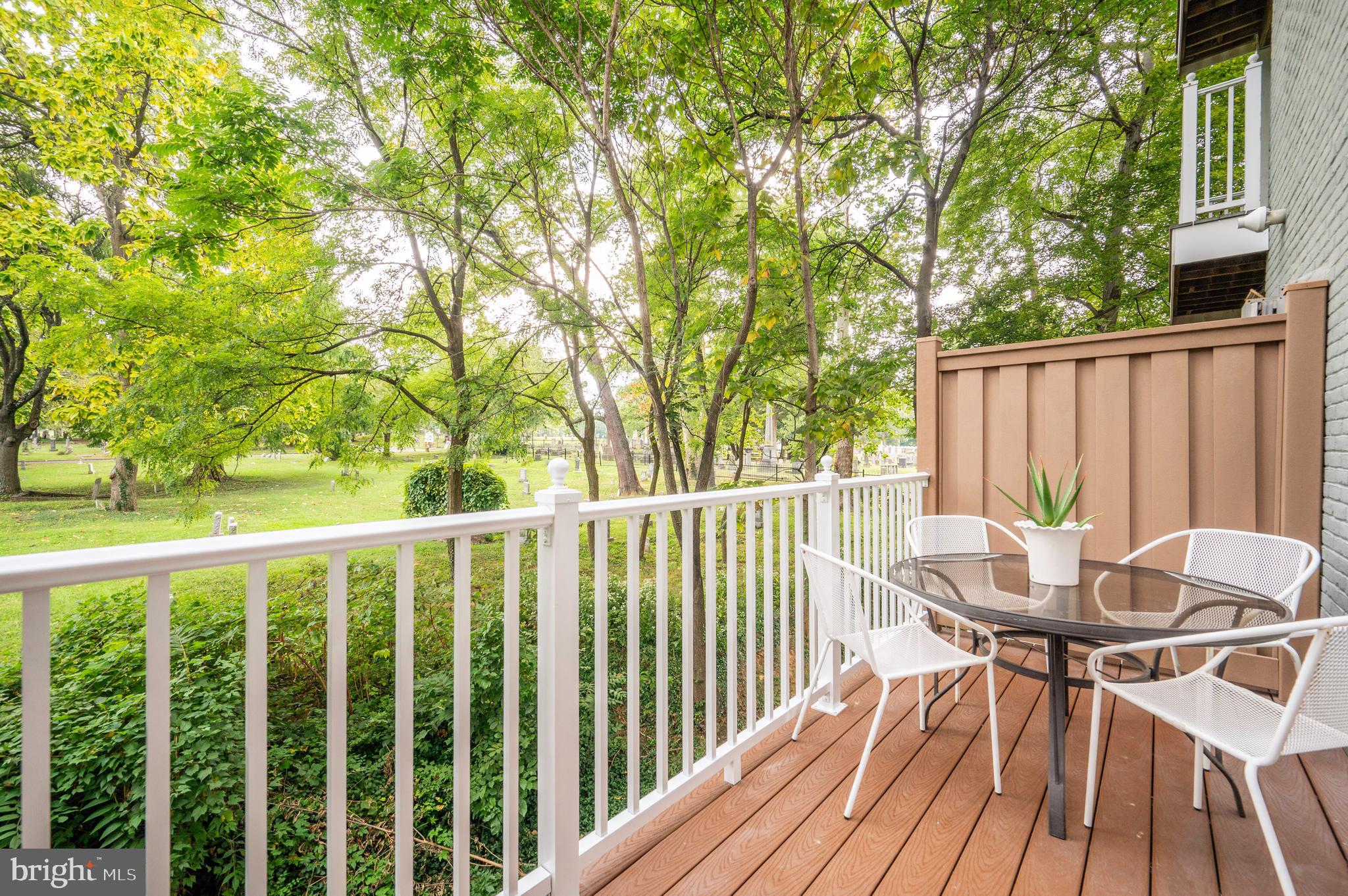 1422 Roundhouse Lane, Unit 1422 Alexandria, VA 22314 - Photo 18 of 73 a view of a chairs and table in patio with wooden fence