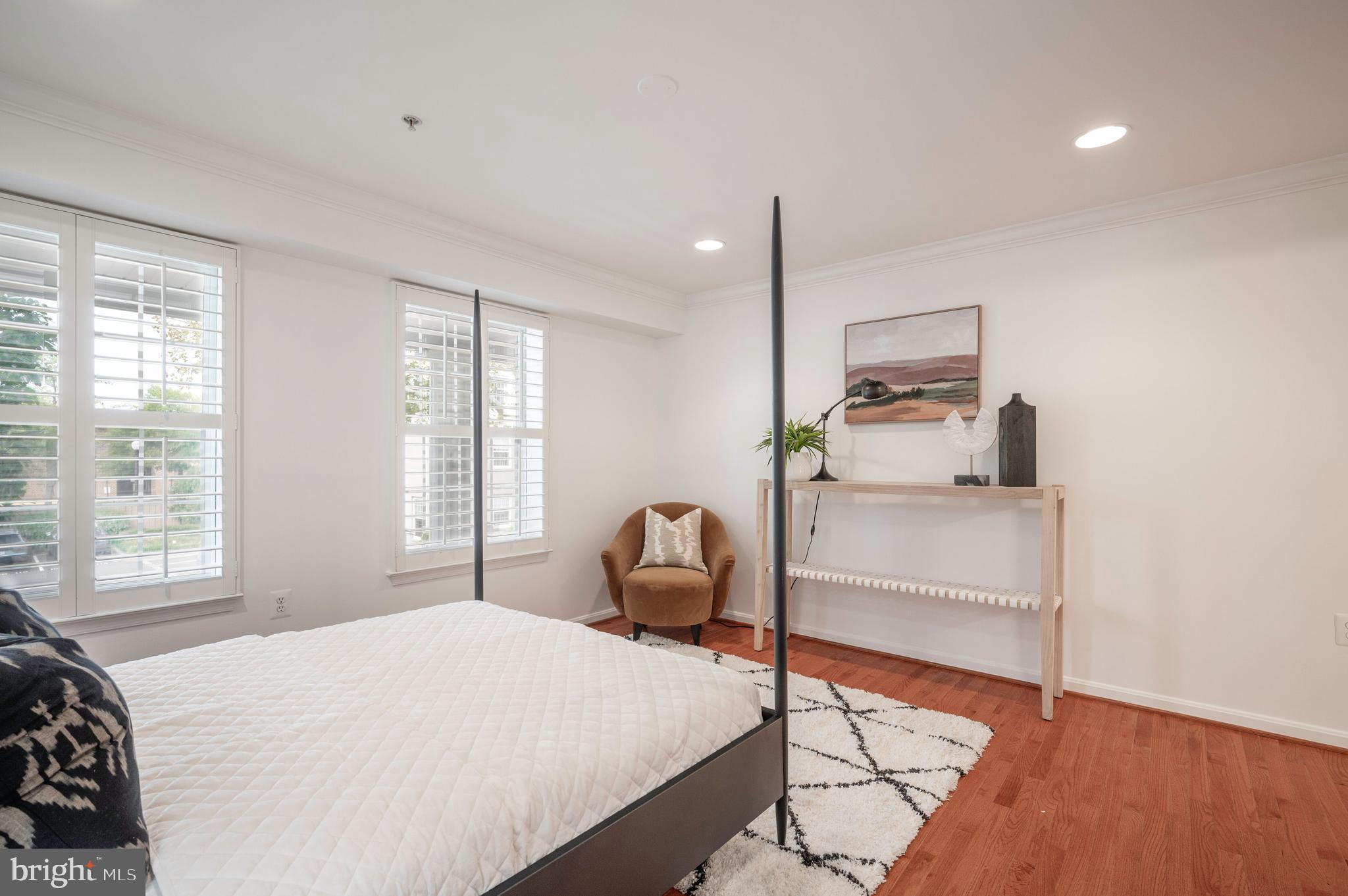 1422 Roundhouse Lane, Unit 1422 Alexandria, VA 22314 - Photo 22 of 73 a bedroom with a bed and wooden floor