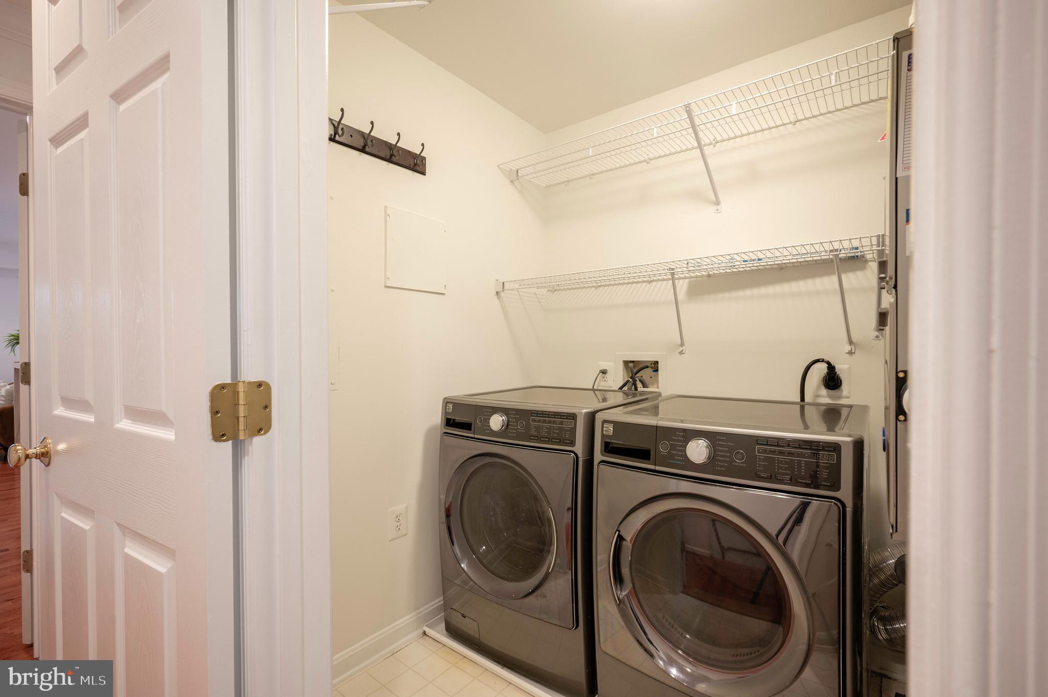 1422 Roundhouse Lane, Unit 1422 Alexandria, VA 22314 - Photo 24 of 73 a view of a hallway with washer and dryer