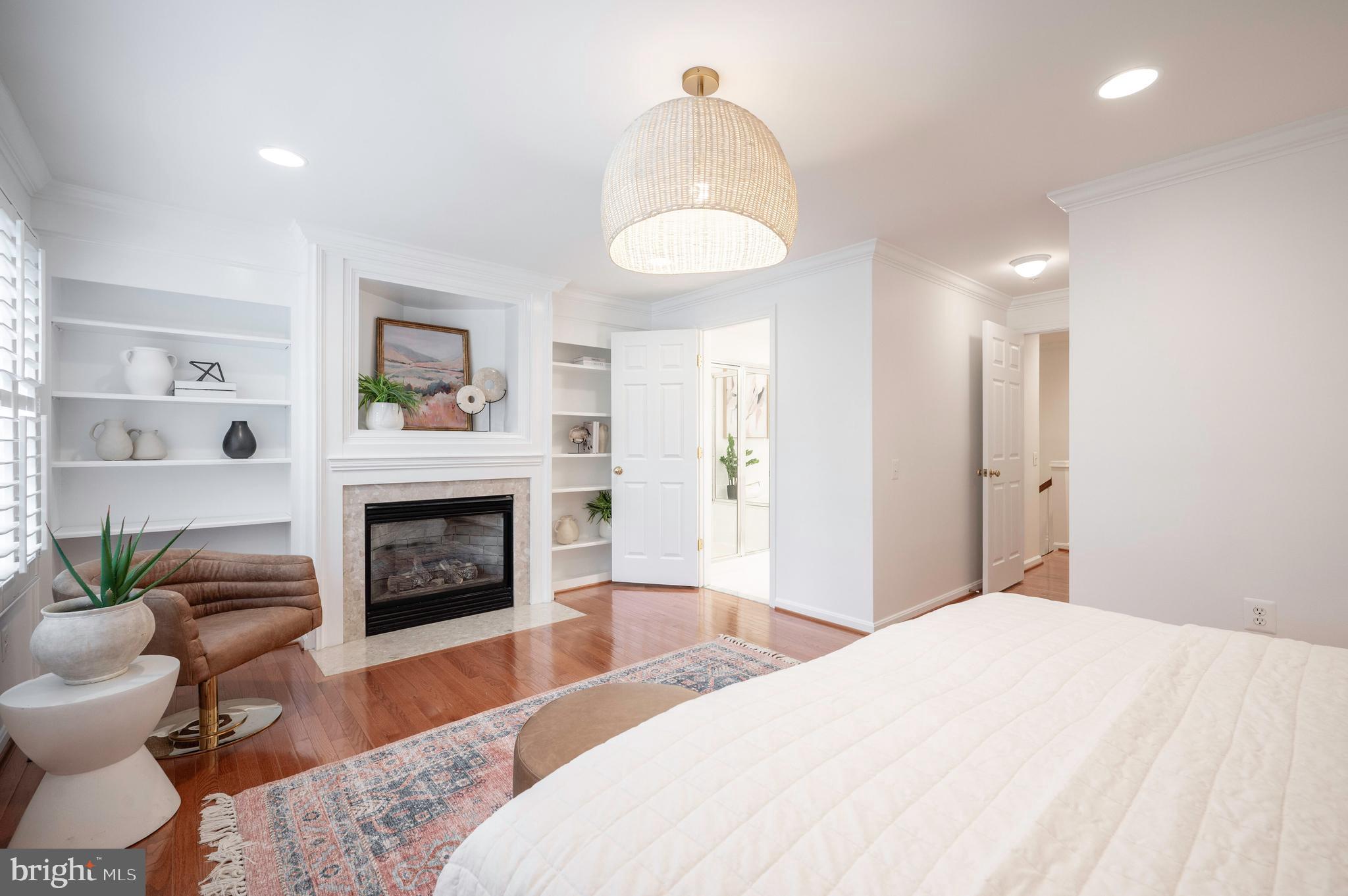 1422 Roundhouse Lane, Unit 1422 Alexandria, VA 22314 - Photo 25 of 73 a bedroom with a bed and a fireplace