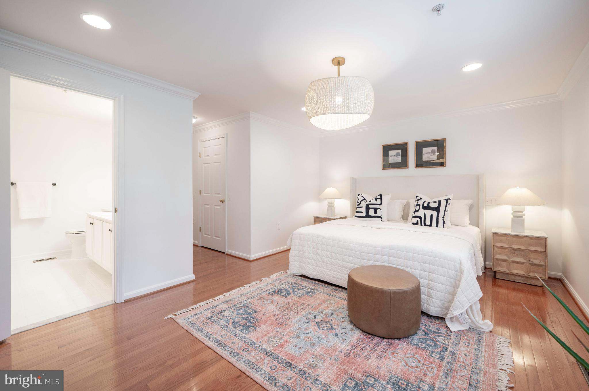 1422 Roundhouse Lane, Unit 1422 Alexandria, VA 22314 - Photo 26 of 73 a bedroom with a bed and wooden floor