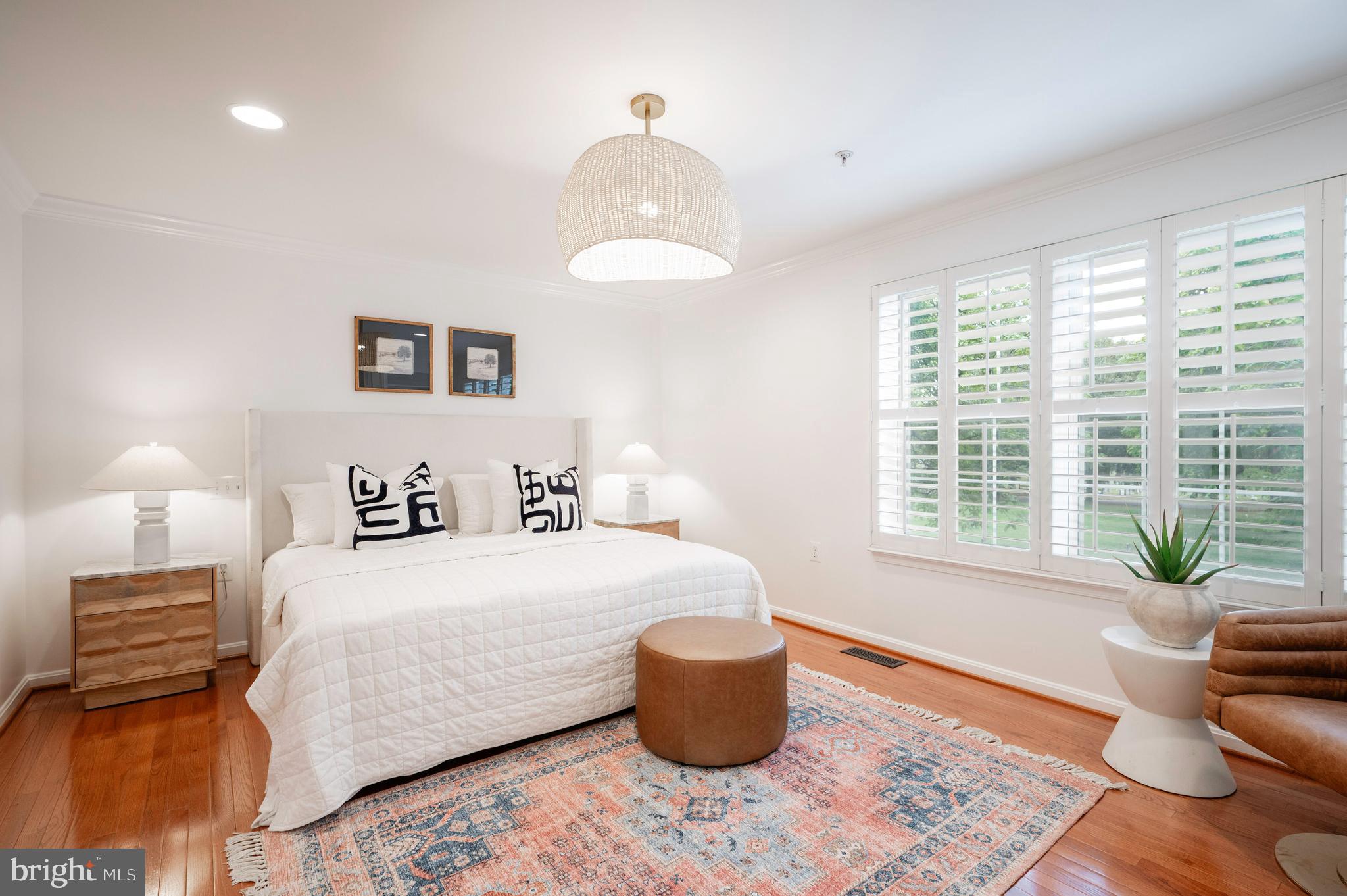 1422 Roundhouse Lane, Unit 1422 Alexandria, VA 22314 - Photo 29 of 73 a bedroom with a bed and wooden floor