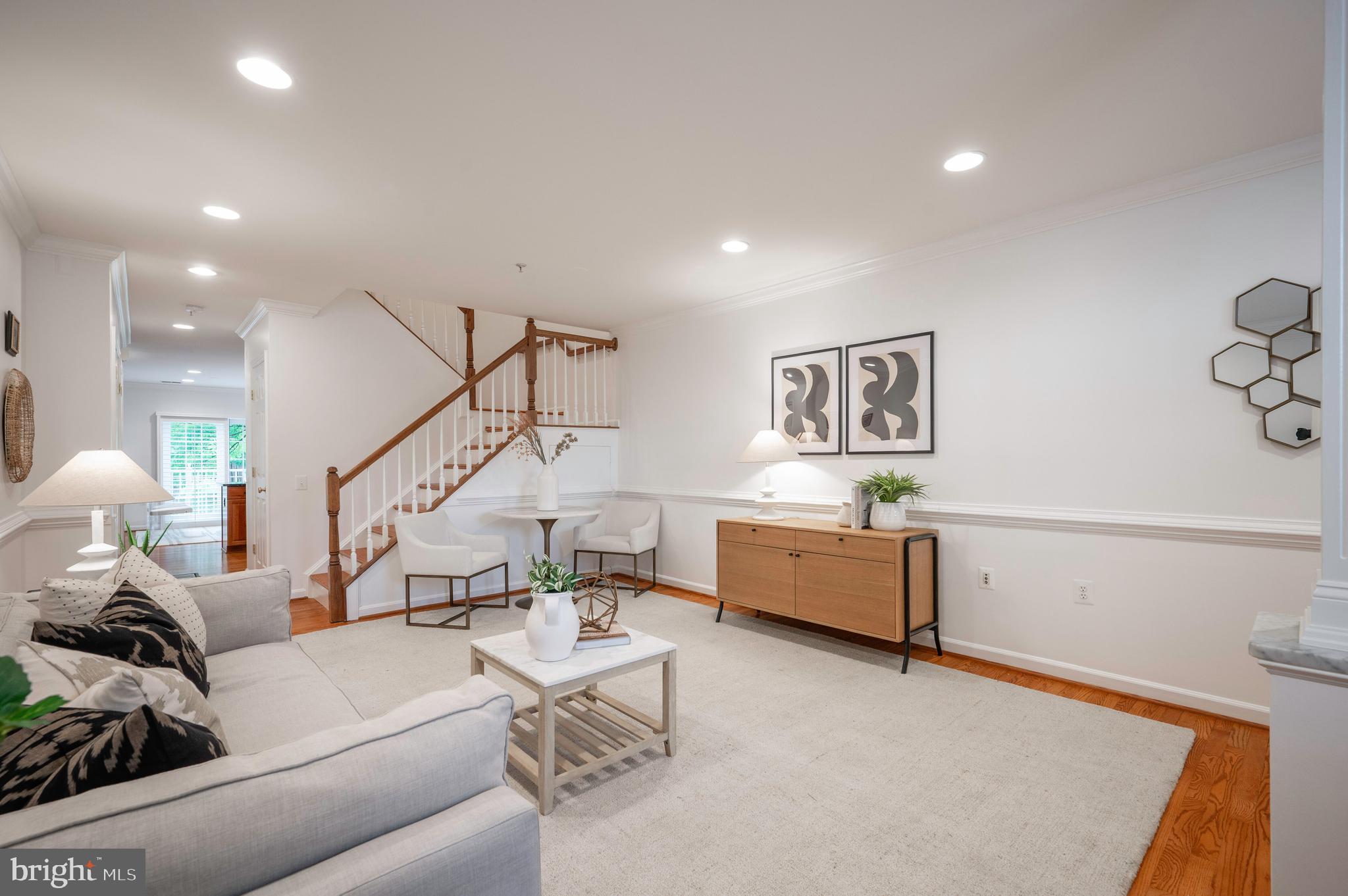 1422 Roundhouse Lane, Unit 1422 Alexandria, VA 22314 - Photo 7 of 73 a living room with furniture and stairs