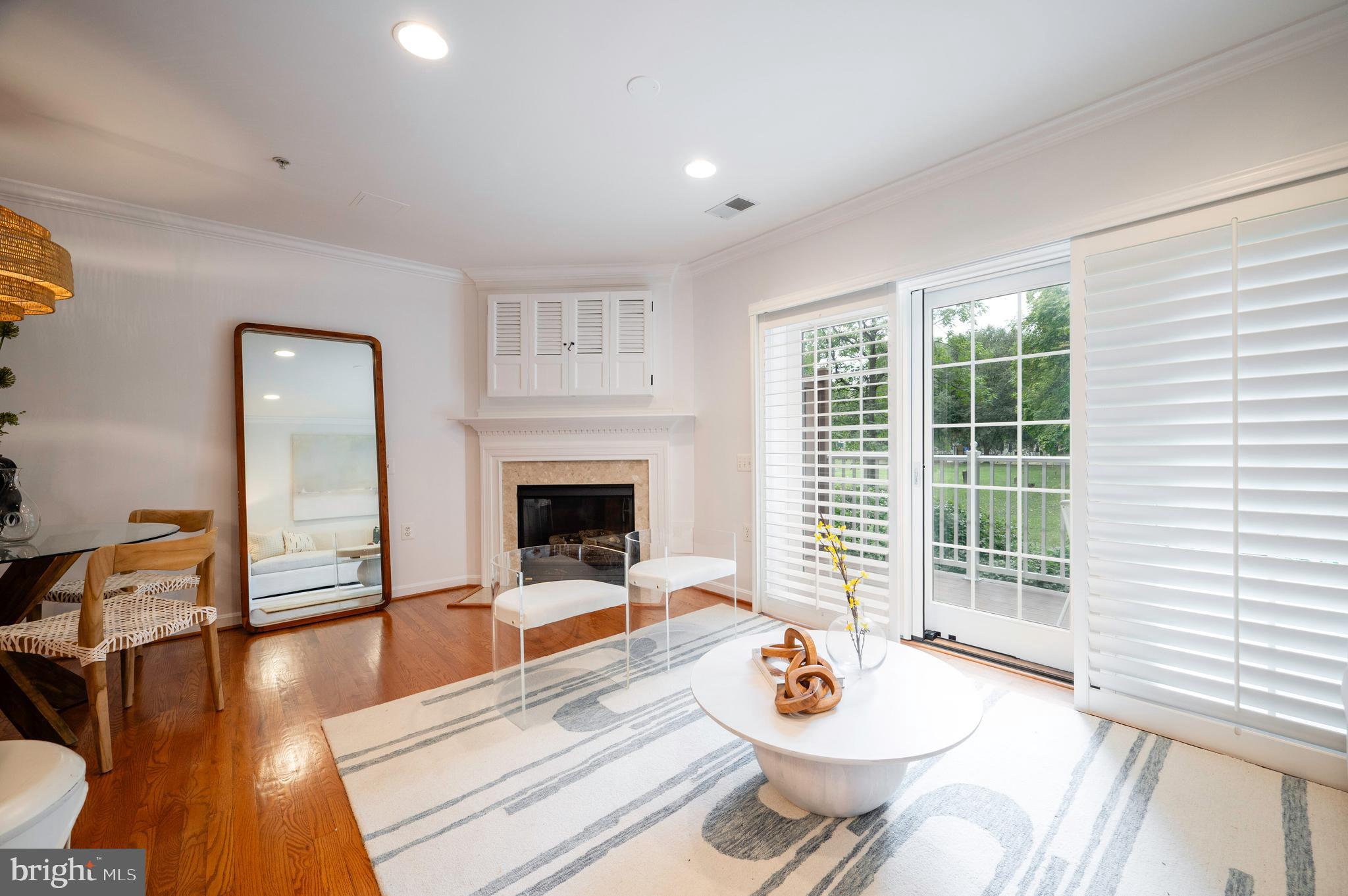 1422 Roundhouse Lane, Unit 1422 Alexandria, VA 22314 - Photo 10 of 73 a living room with furniture and a fireplace