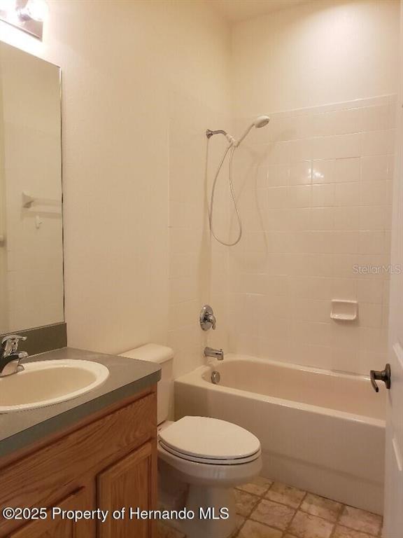 15206 Copper Loop Brooksville, FL 34604 - Photo 16 of 29 a bathroom with a sink toilet and shower