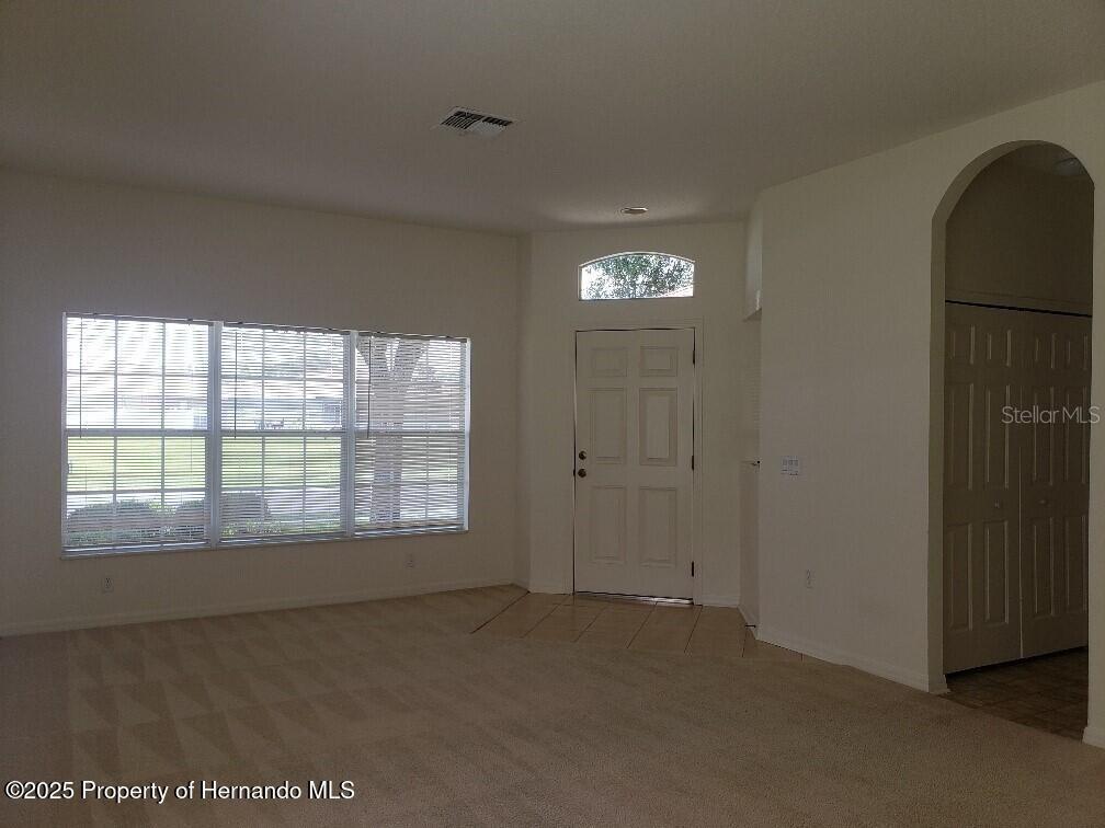 15206 Copper Loop Brooksville, FL 34604 - Photo 17 of 29 a view of an empty room with a window