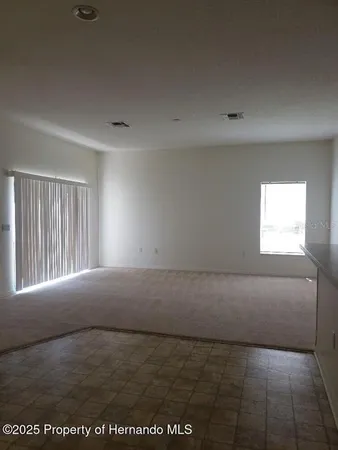 a view of an empty room and window