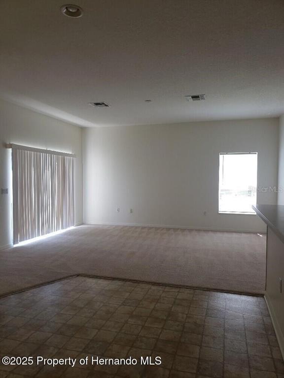 15206 Copper Loop Brooksville, FL 34604 - Photo 20 of 29 a view of an empty room and window