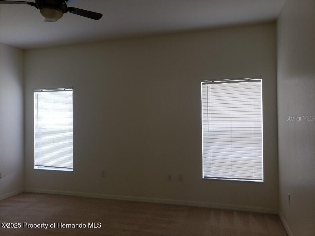 15206 Copper Loop Brooksville, FL 34604 - Photo 22 of 29 an empty room with a window