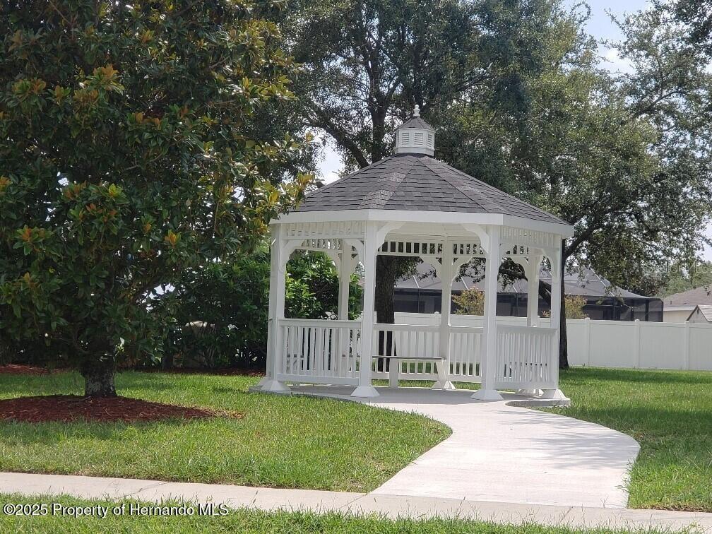 15206 Copper Loop Brooksville, FL 34604 - Photo 27 of 29 a view of a house with a yard
