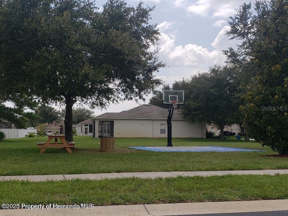 15206 Copper Loop Brooksville, FL 34604 - Photo 29 of 29 a front view of a house with a yard
