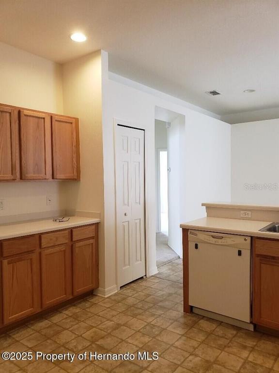 15206 Copper Loop Brooksville, FL 34604 - Photo 9 of 29 a kitchen with a sink and cabinets