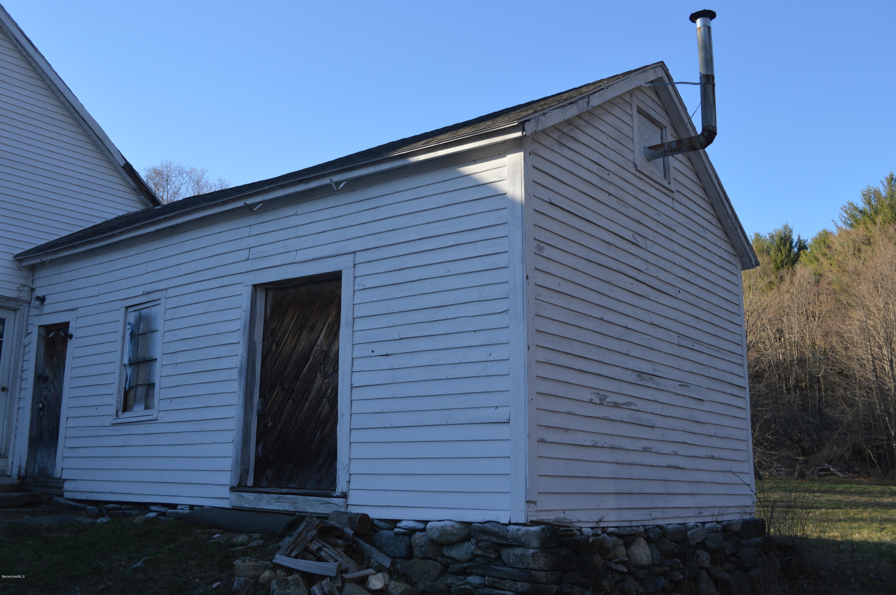 1892 North Main Road Otis, MA 01253 - Photo 17 of 19 a front view of a house with a yard
