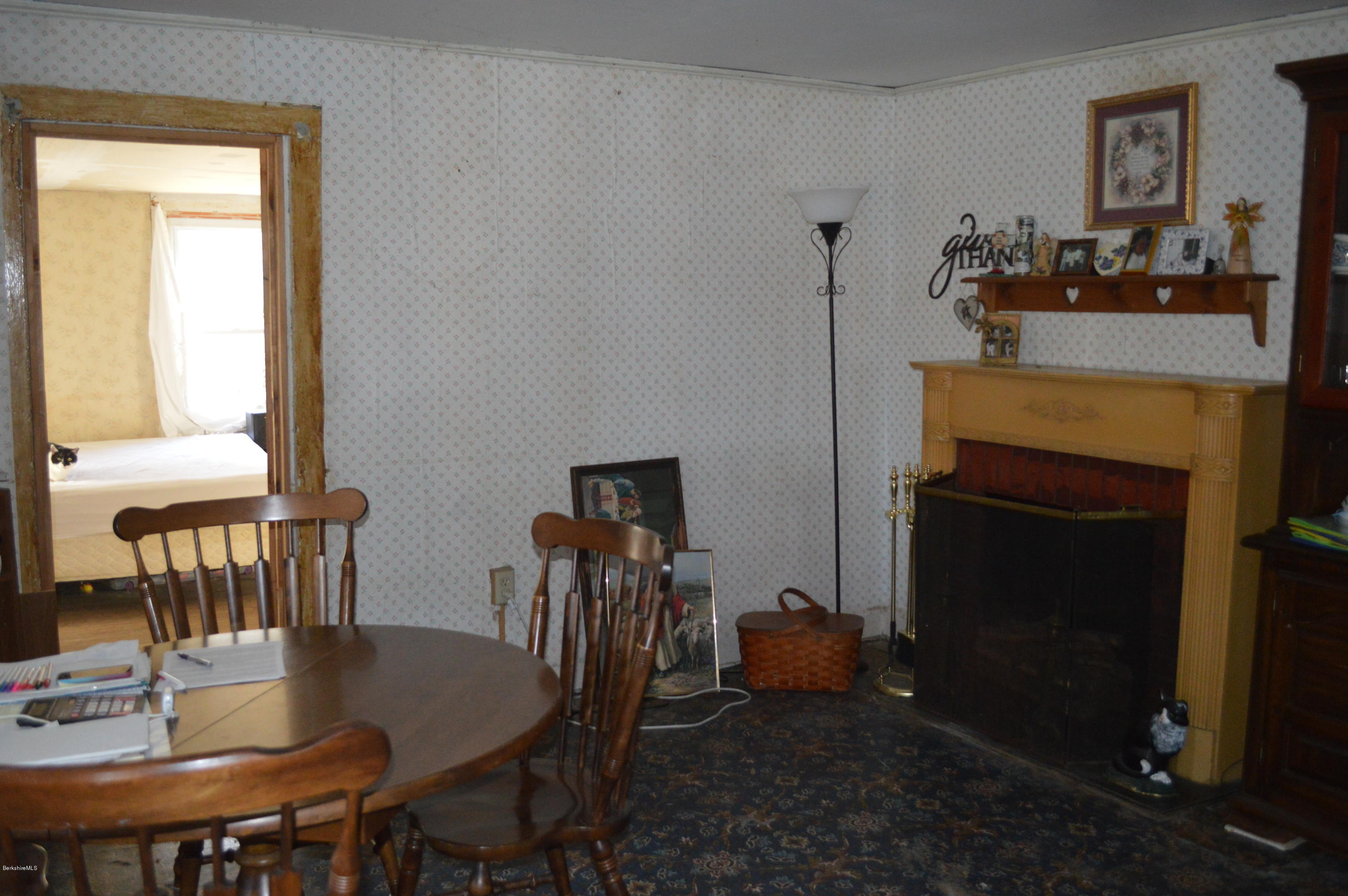 1892 North Main Road Otis, MA 01253 - Photo 5 of 19 a view of a dining room with furniture and wooden floor