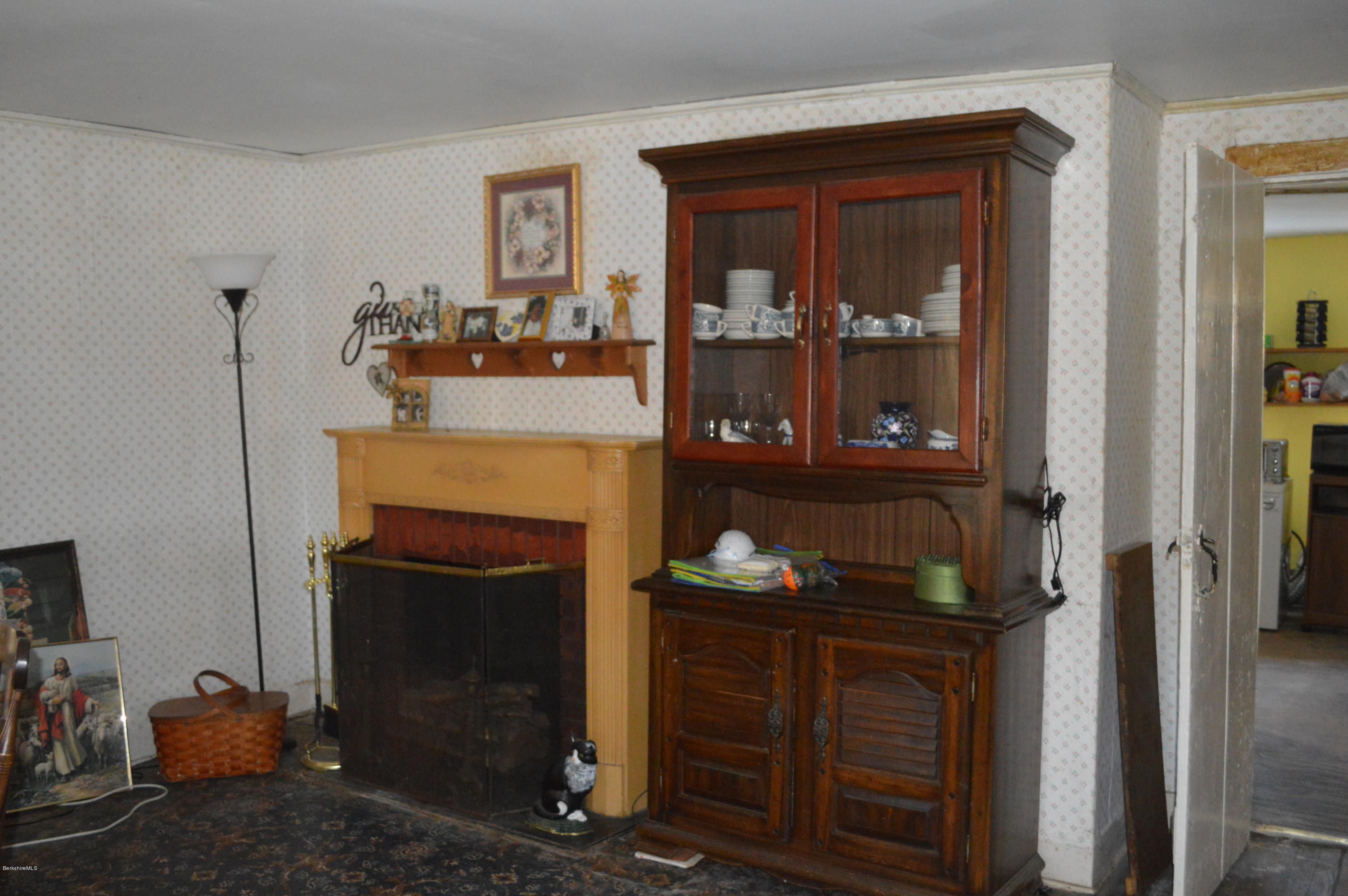 1892 North Main Road Otis, MA 01253 - Photo 6 of 19 a living room with furniture and a fireplace
