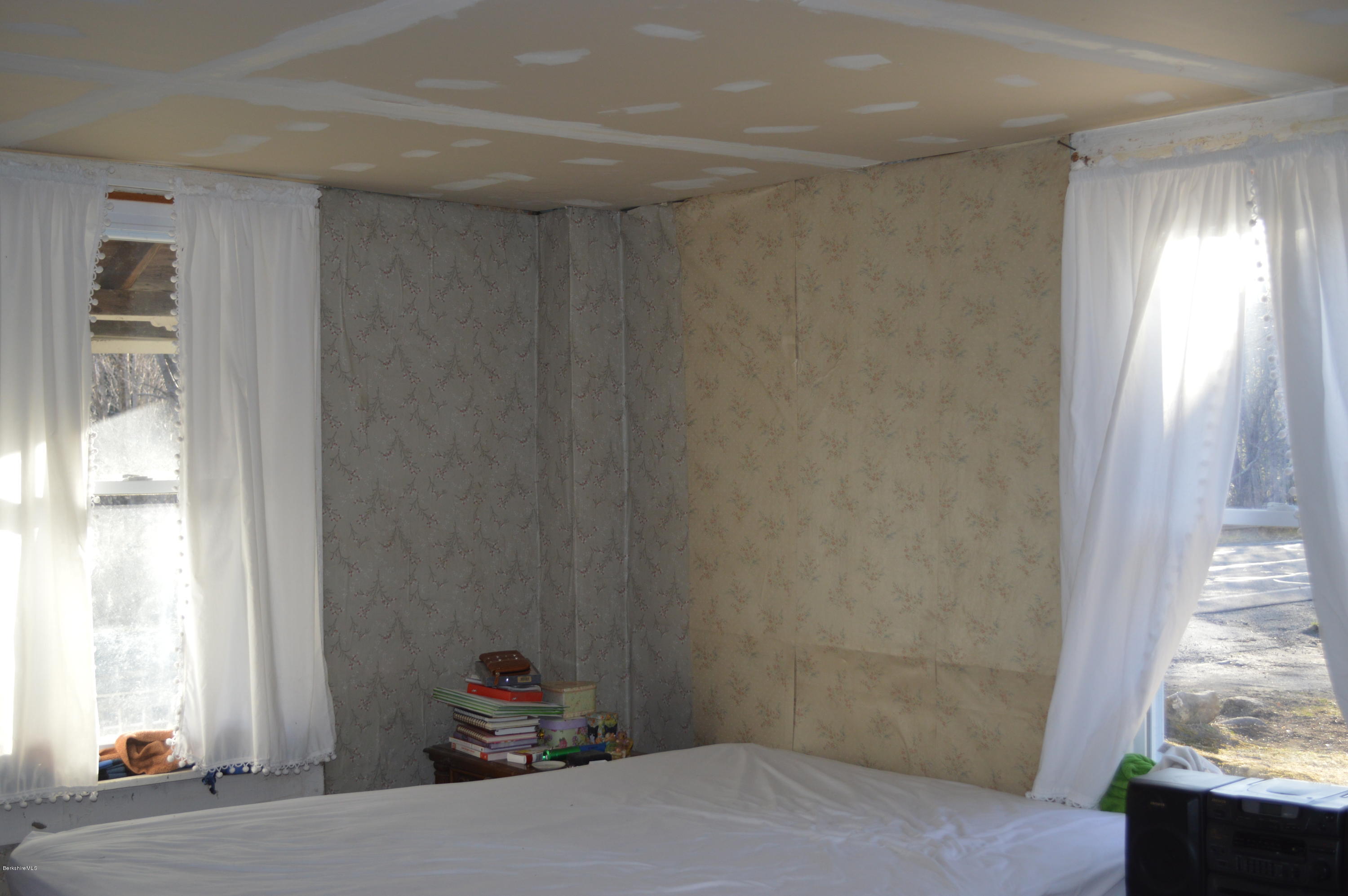 1892 North Main Road Otis, MA 01253 - Photo 10 of 19 a bedroom with a bed and a window