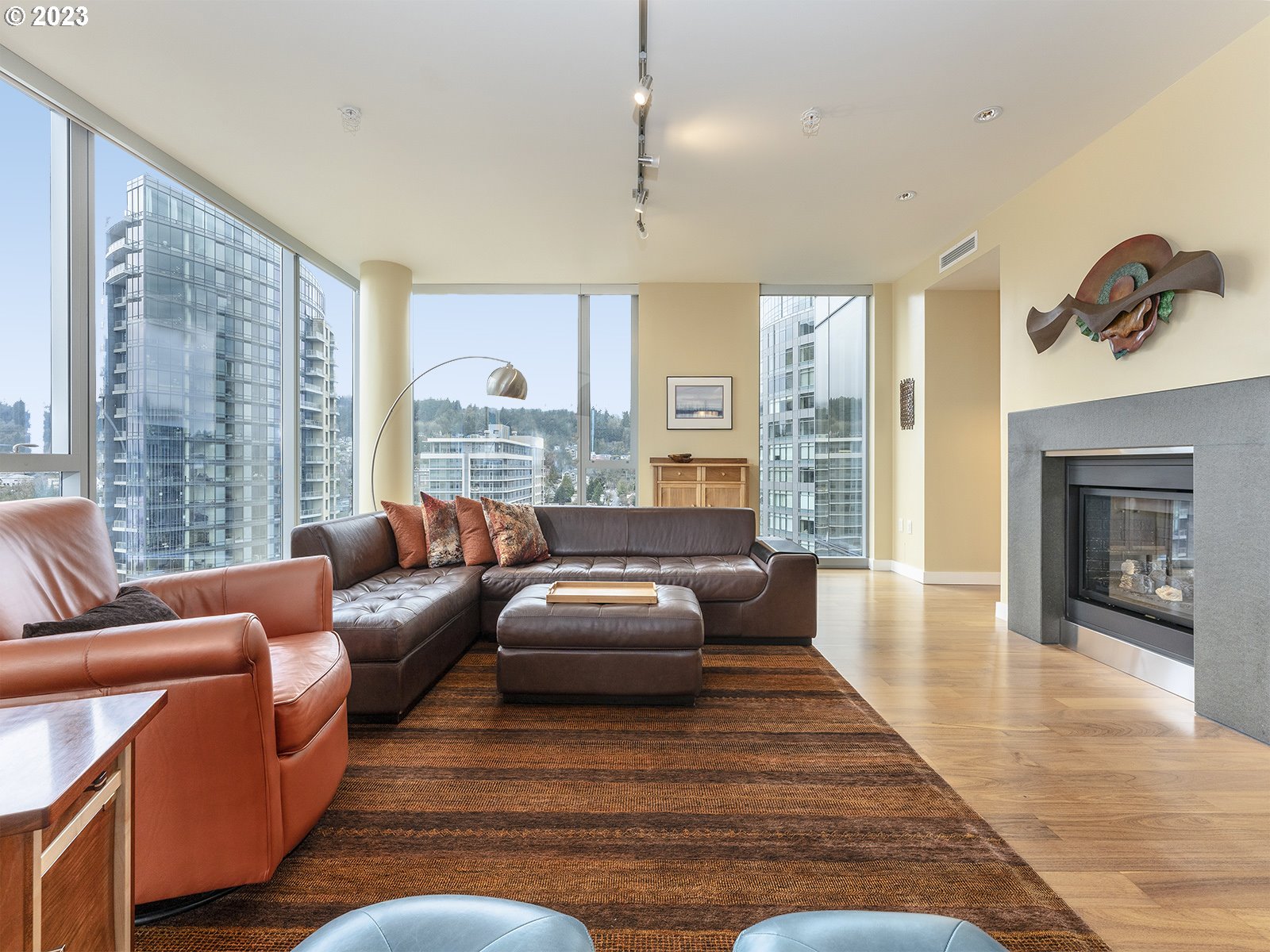841 Southwest Gaines Street, Unit 1912 Portland, OR 97239 - Photo 13 of 32 a living room with furniture floor to ceiling window and wooden floor