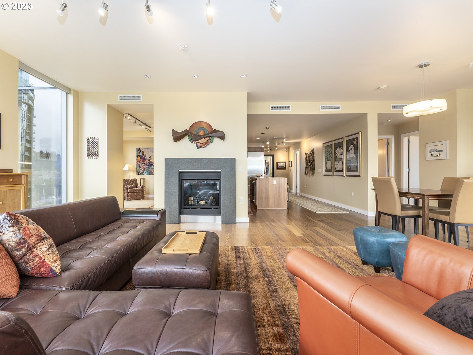 841 Southwest Gaines Street, Unit 1912 Portland, OR 97239 - Photo 14 of 32 a living room with furniture and a fireplace
