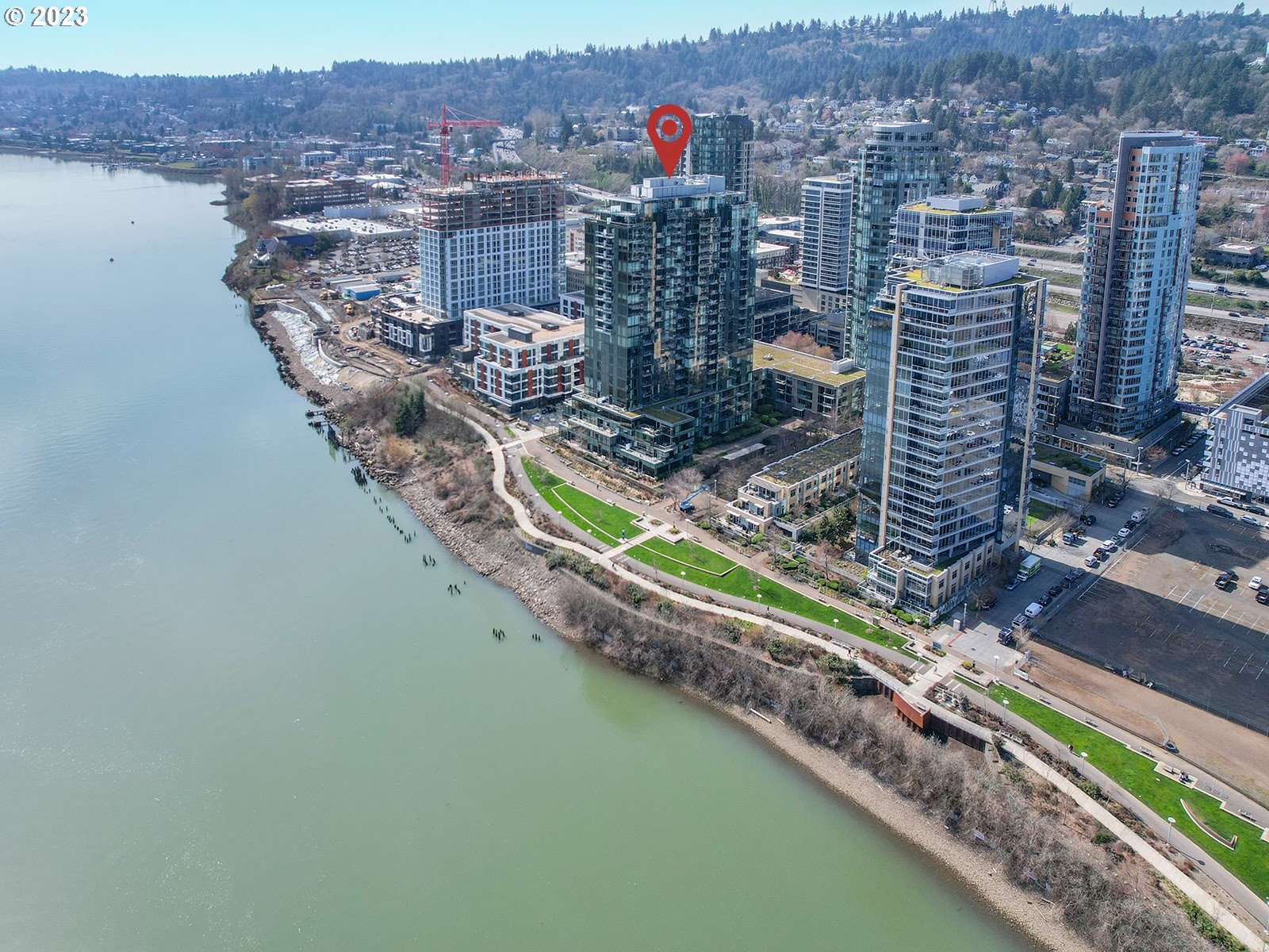 841 Southwest Gaines Street, Unit 1912 Portland, OR 97239 - Photo 2 of 32 a city view with tall buildings