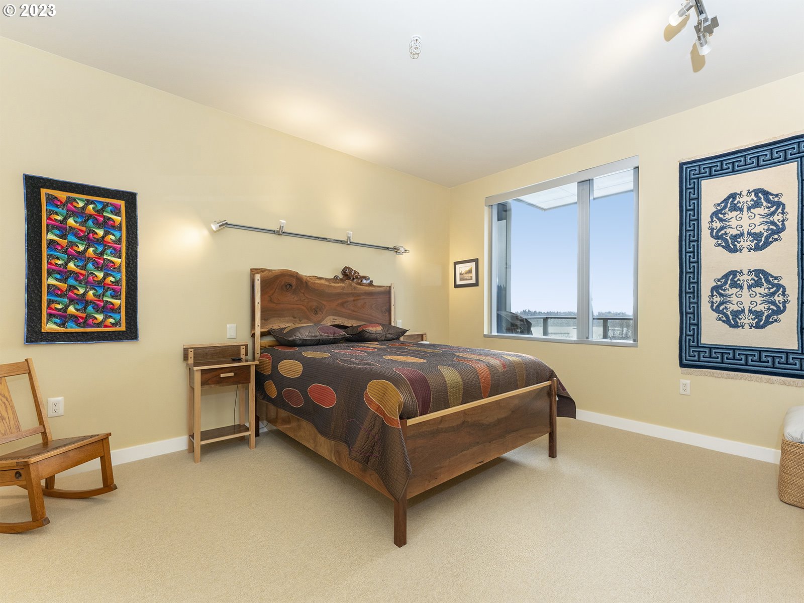 841 Southwest Gaines Street, Unit 1912 Portland, OR 97239 - Photo 21 of 32 a bedroom with a bed and a couch