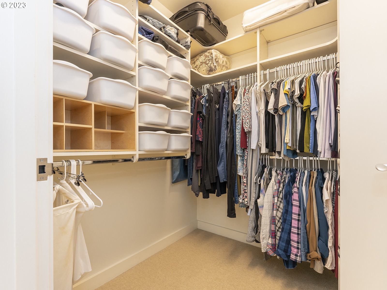 841 Southwest Gaines Street, Unit 1912 Portland, OR 97239 - Photo 25 of 32 a view of walk in closet with clothes and shoes