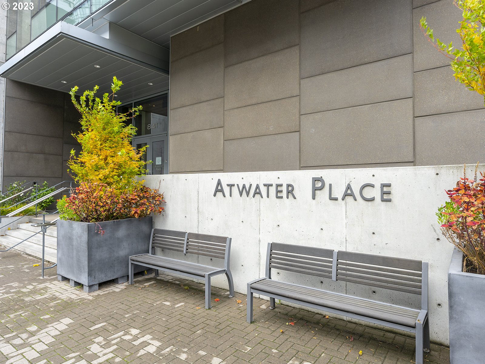 841 Southwest Gaines Street, Unit 1912 Portland, OR 97239 - Photo 4 of 32 a view of a bench in back of a building