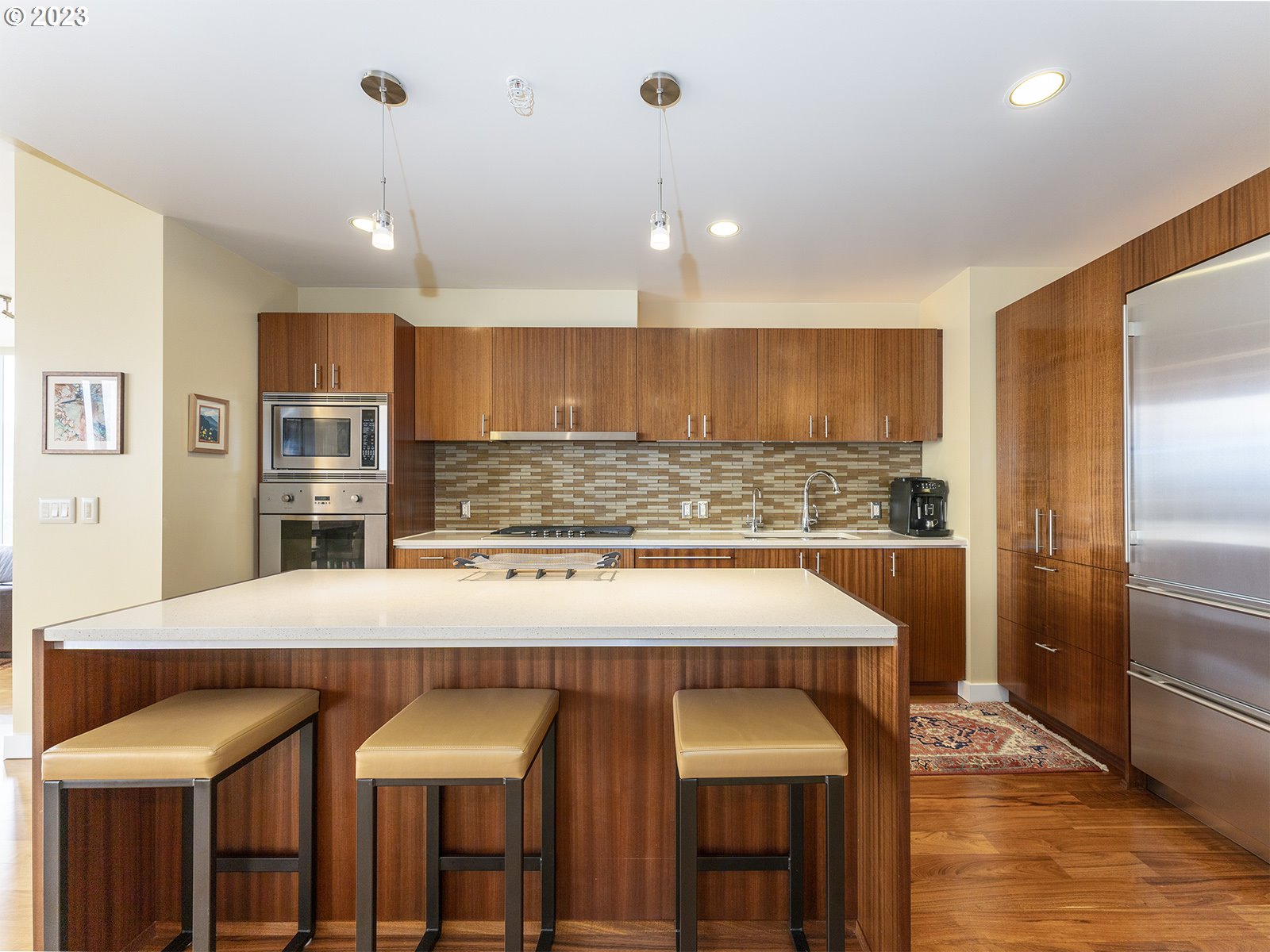 841 Southwest Gaines Street, Unit 1912 Portland, OR 97239 - Photo 5 of 32 a kitchen with a counter space cabinets and appliances