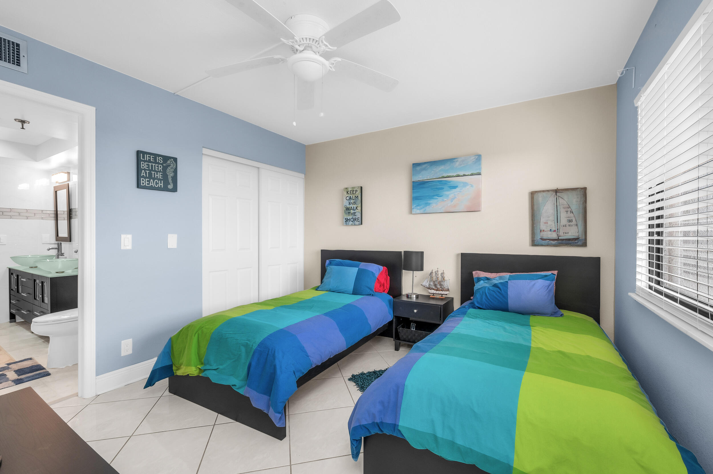 14475 Strathmore Lane, Unit 602 Delray Beach, FL 33446 - Photo 11 of 28 a bedroom with two beds and a window