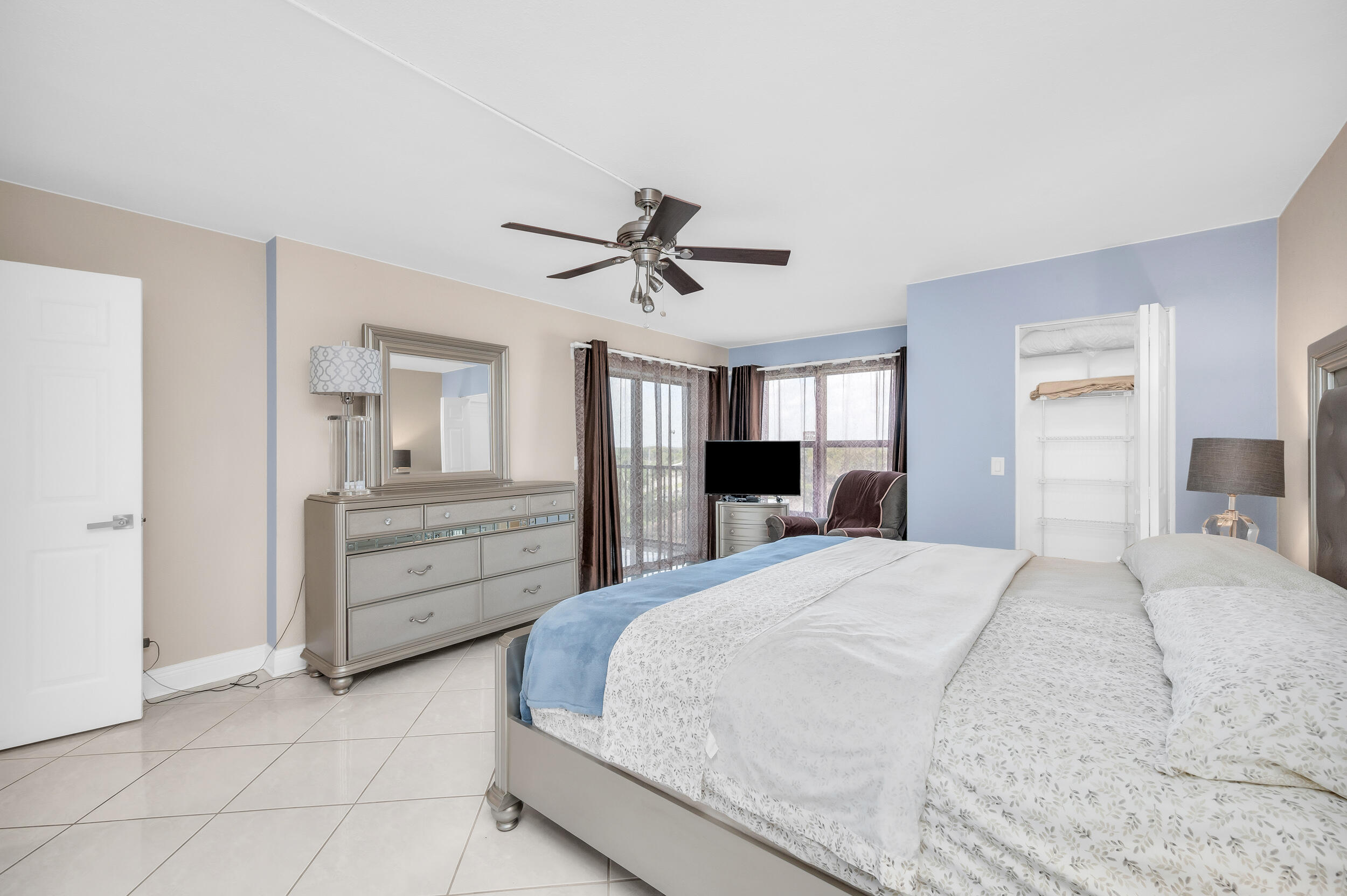 14475 Strathmore Lane, Unit 602 Delray Beach, FL 33446 - Photo 16 of 28 a bed room with a bed and a television