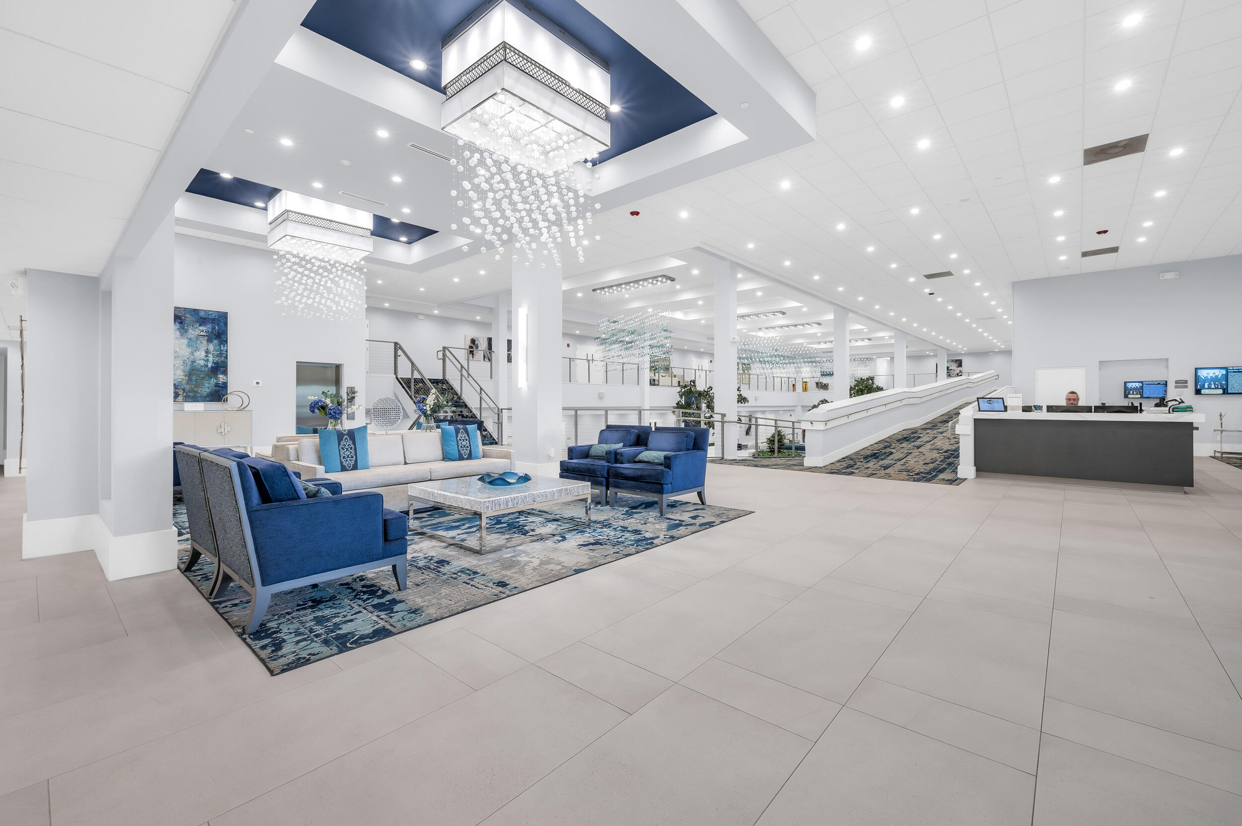 14475 Strathmore Lane, Unit 602 Delray Beach, FL 33446 - Photo 18 of 28 a living room with furniture and a chandelier