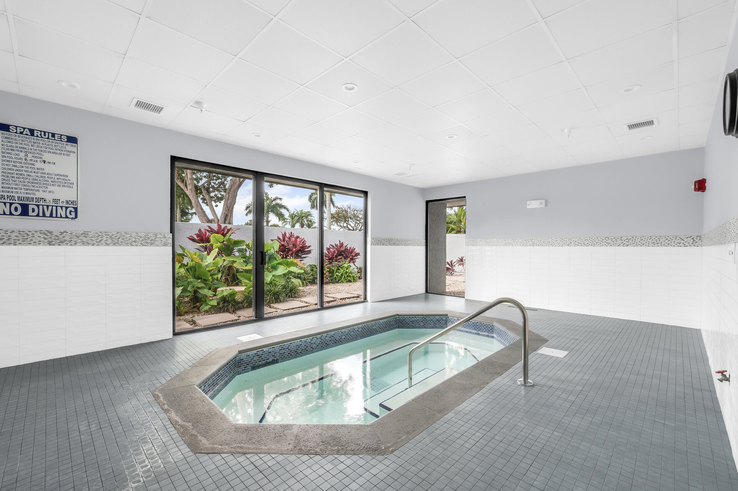 14475 Strathmore Lane, Unit 602 Delray Beach, FL 33446 - Photo 23 of 28 a living room with furniture and a large window
