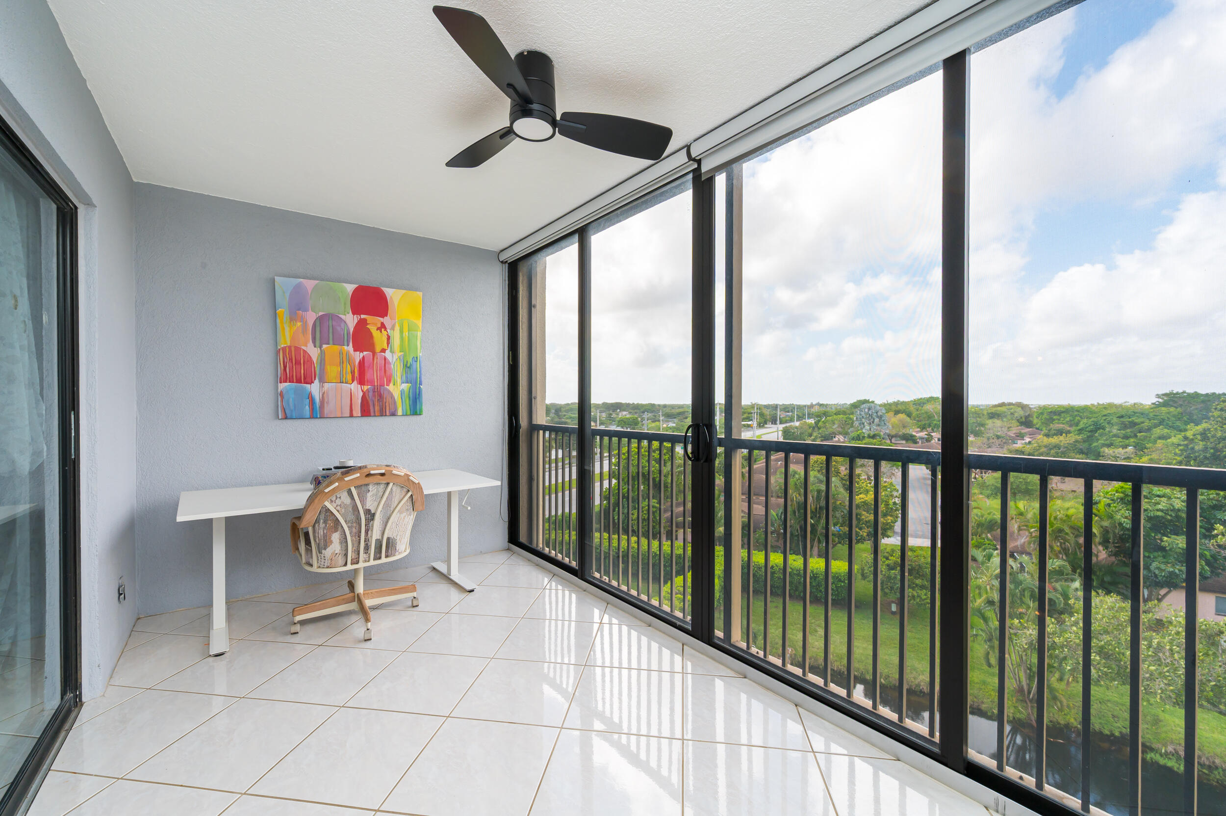 14475 Strathmore Lane, Unit 602 Delray Beach, FL 33446 - Photo 26 of 28 a living room with furniture and a floor to ceiling window