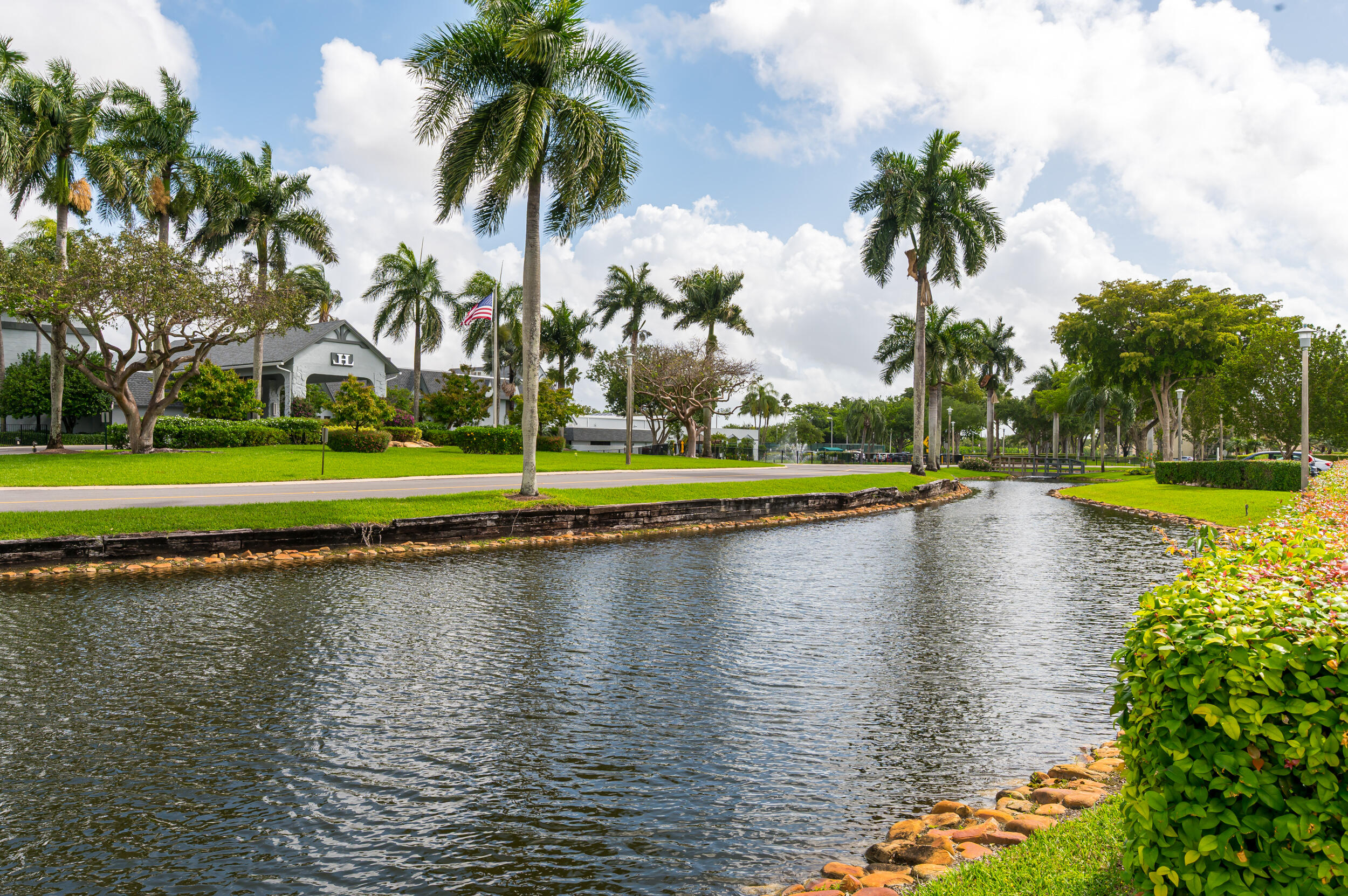 14475 Strathmore Lane, Unit 602 Delray Beach, FL 33446 - Photo 28 of 28 a view of a swimming pool and lake view