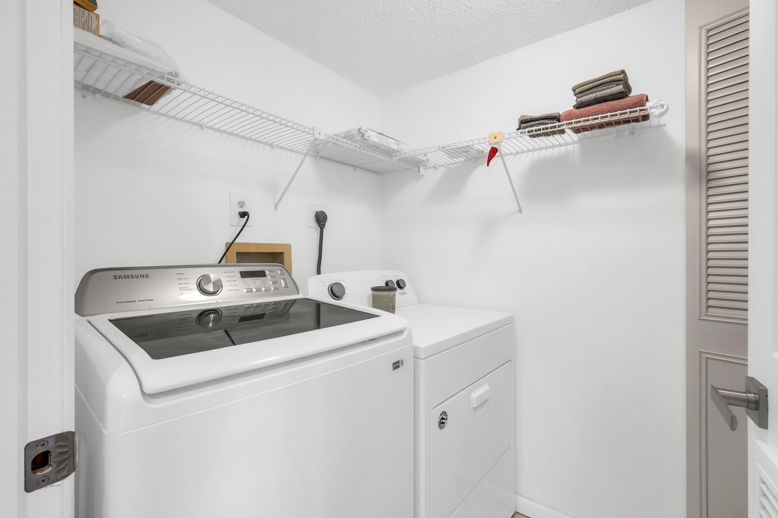 14475 Strathmore Lane, Unit 602 Delray Beach, FL 33446 - Photo 5 of 28 a utility room with dryer and washer