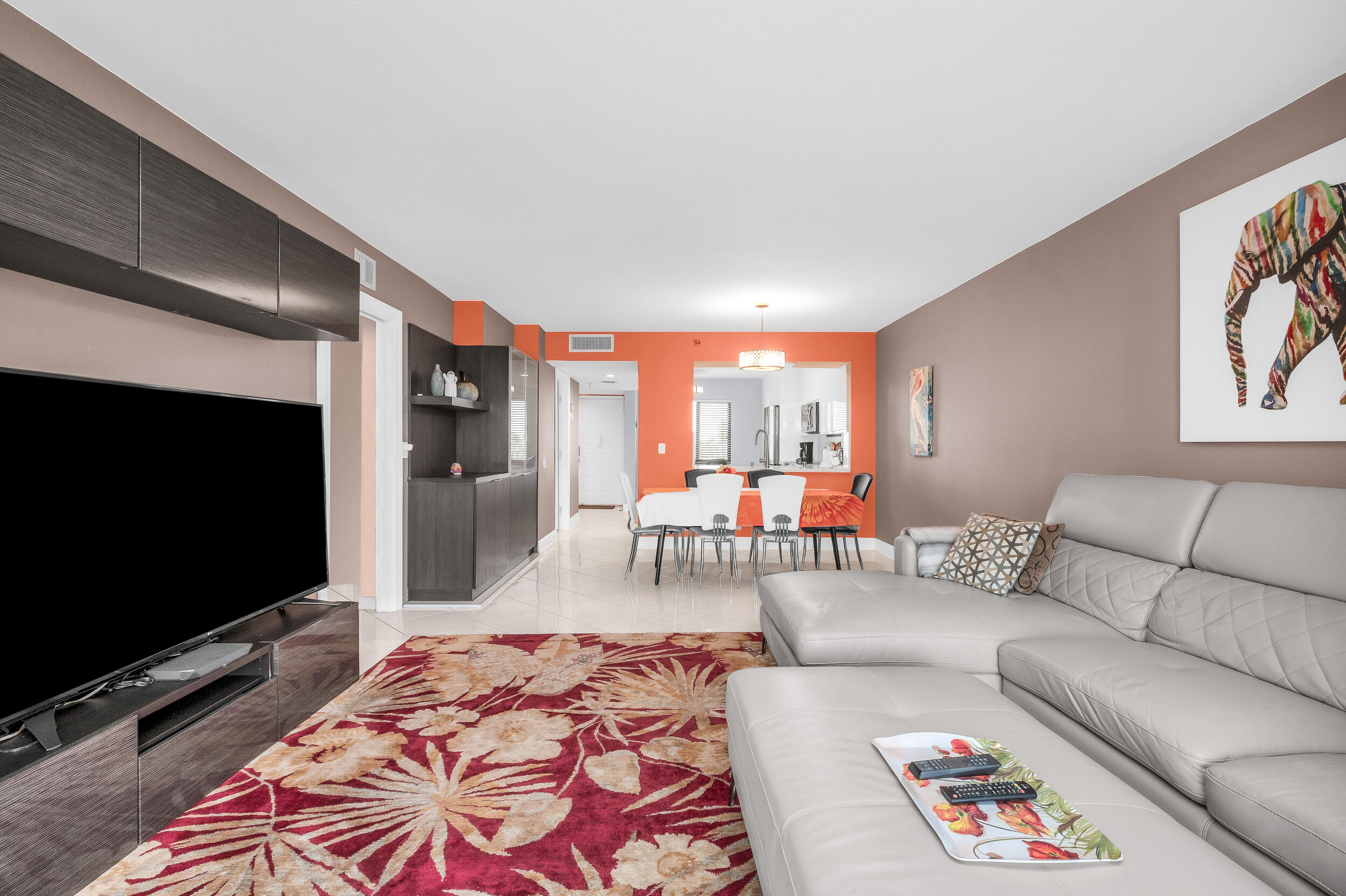 14475 Strathmore Lane, Unit 602 Delray Beach, FL 33446 - Photo 9 of 28 a living room with furniture and a flat screen tv