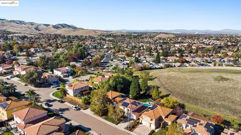 an aerial view of residential building and ocean view