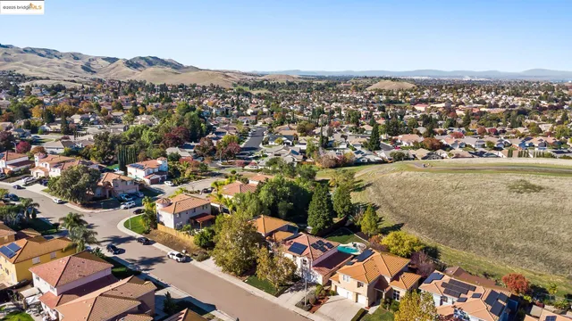 an aerial view of residential building and ocean view