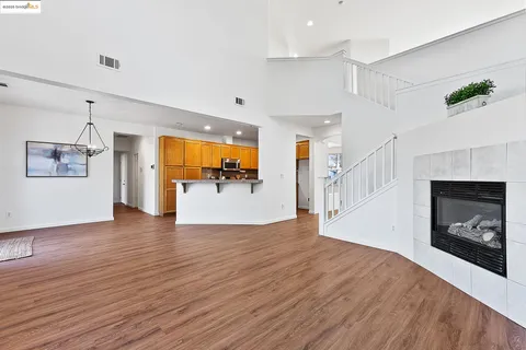 a view of a living room a window and a fireplace