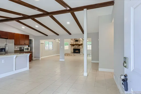 a view of living room with furniture and window