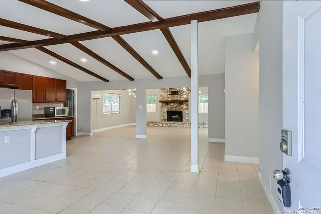 a view of living room with furniture and window