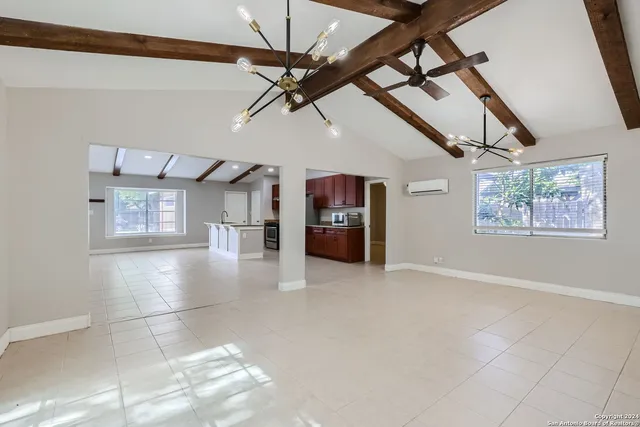 a view interior of a house an entryway and fire place