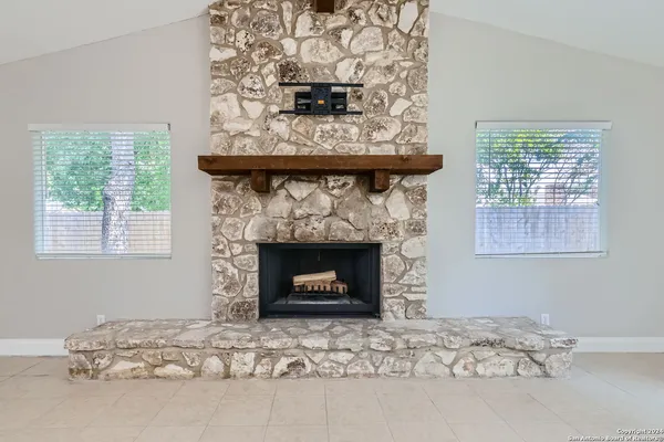 a living room with a fireplace