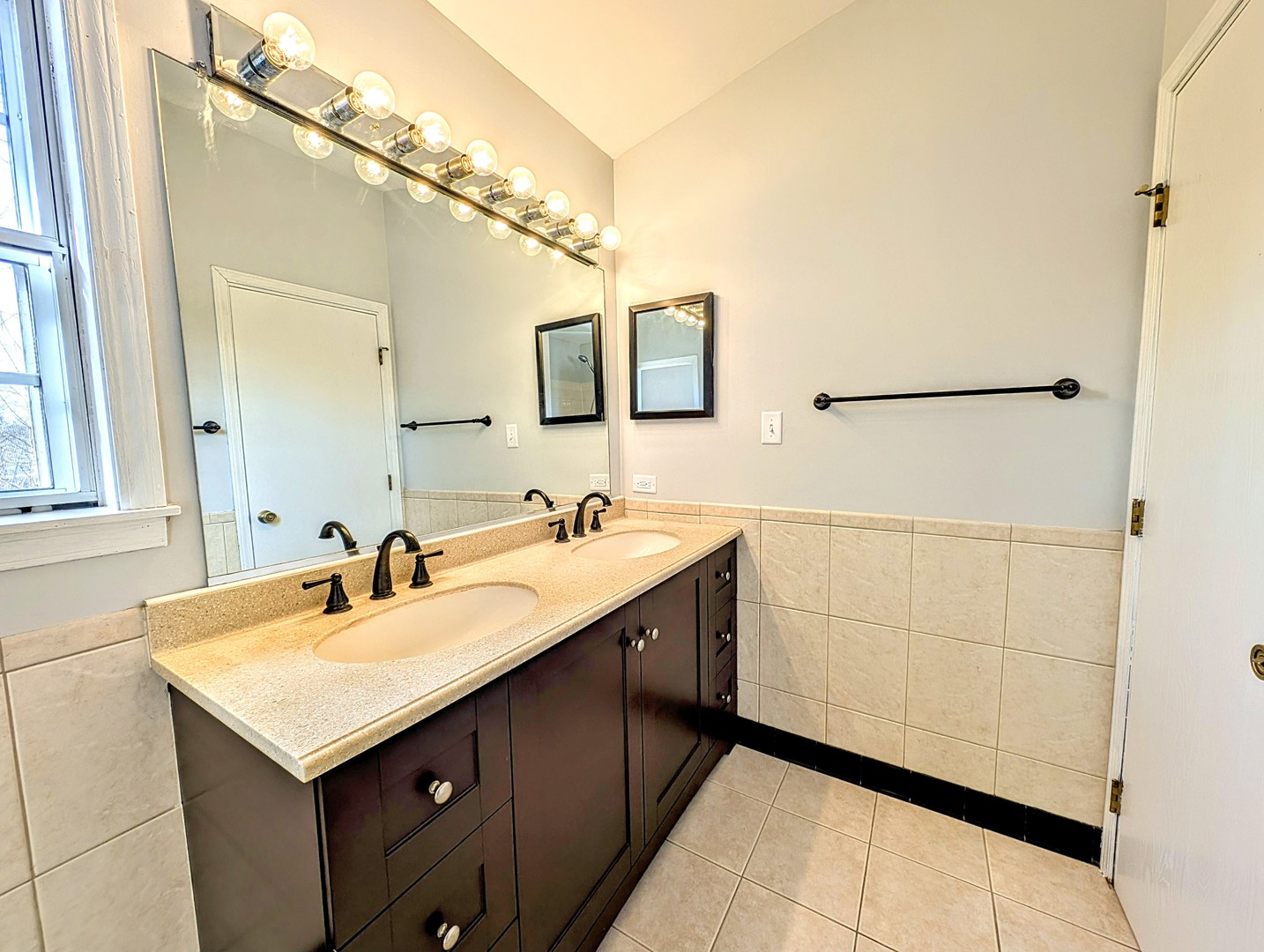 1030 Oak Ridge Drive Streamwood, IL 60107 - Photo 13 of 19 a bathroom with a sink and a mirror