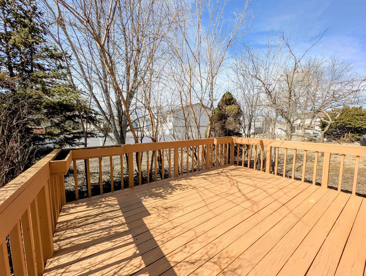 1030 Oak Ridge Drive Streamwood, IL 60107 - Photo 18 of 19 a view of wooden balcony and trees