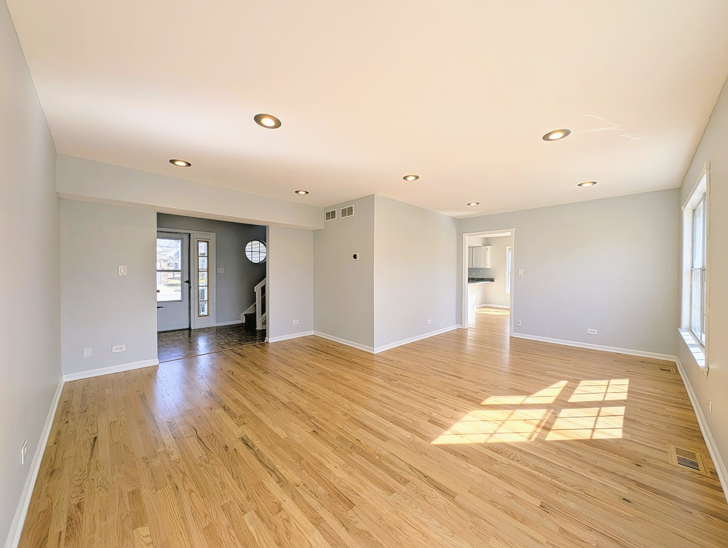 1030 Oak Ridge Drive Streamwood, IL 60107 - Photo 5 of 19 a view of empty room with wooden floor
