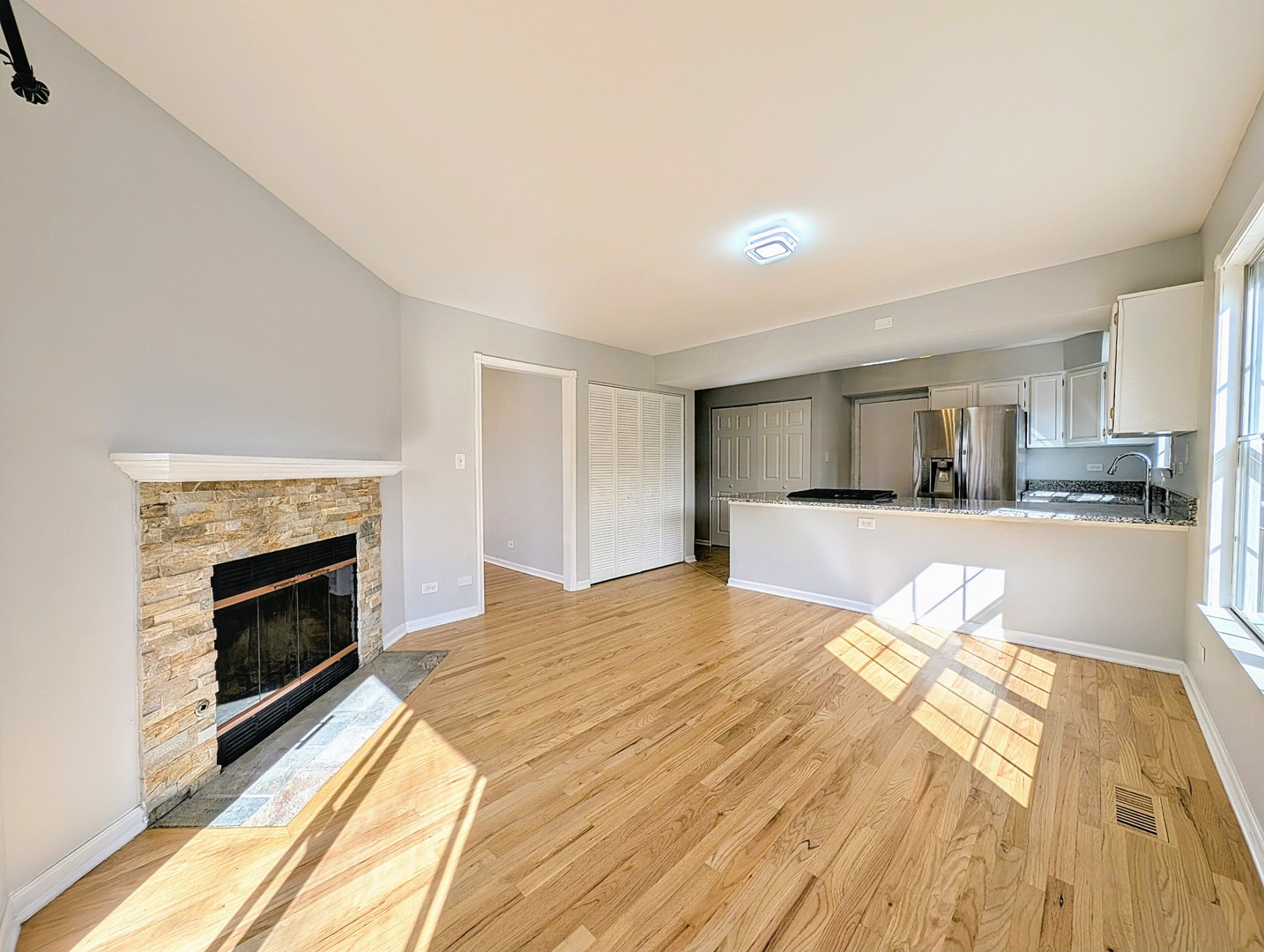 1030 Oak Ridge Drive Streamwood, IL 60107 - Photo 7 of 19 a large bedroom with a bed and a fireplace