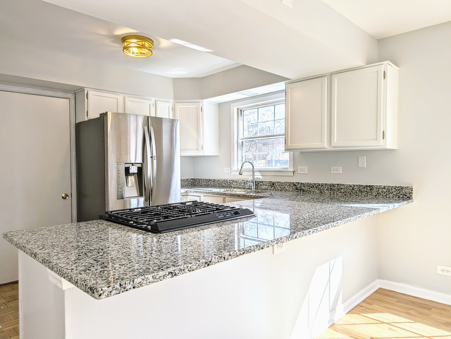 1030 Oak Ridge Drive Streamwood, IL 60107 - Photo 9 of 19 a kitchen with stainless steel appliances granite countertop a sink stove and refrigerator