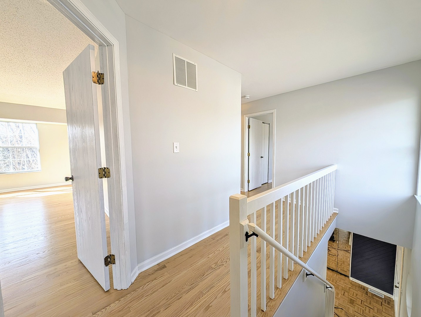 1030 Oak Ridge Drive Streamwood, IL 60107 - Photo 10 of 19 a view of an entryway with wooden floor