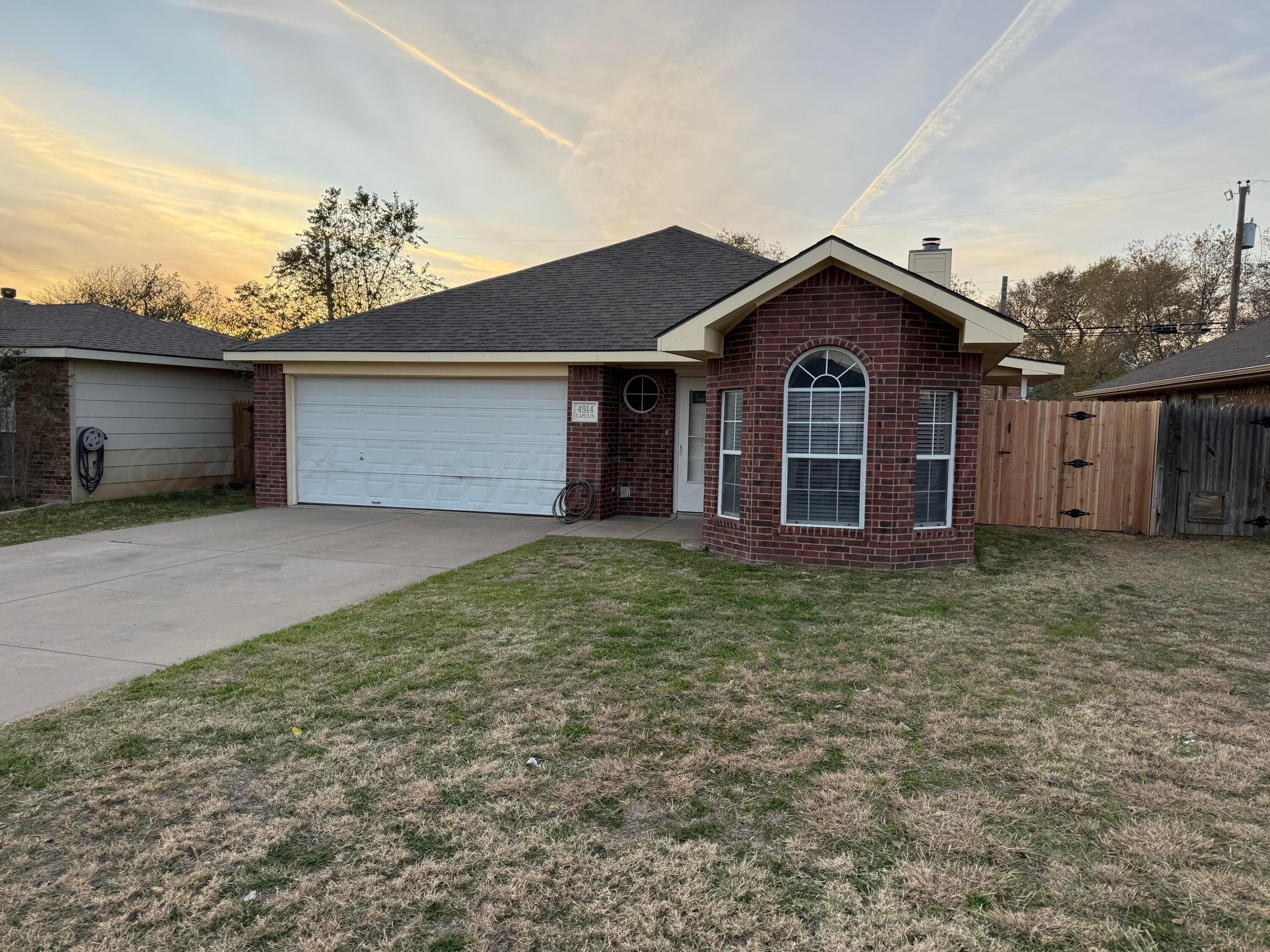 4914 Capulin Lane Amarillo, TX 79110 - Photo 25 of 25 front view of a house with a yard